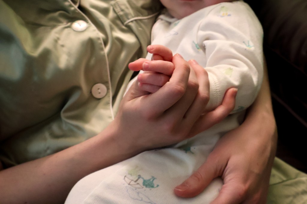 Mother and baby hands