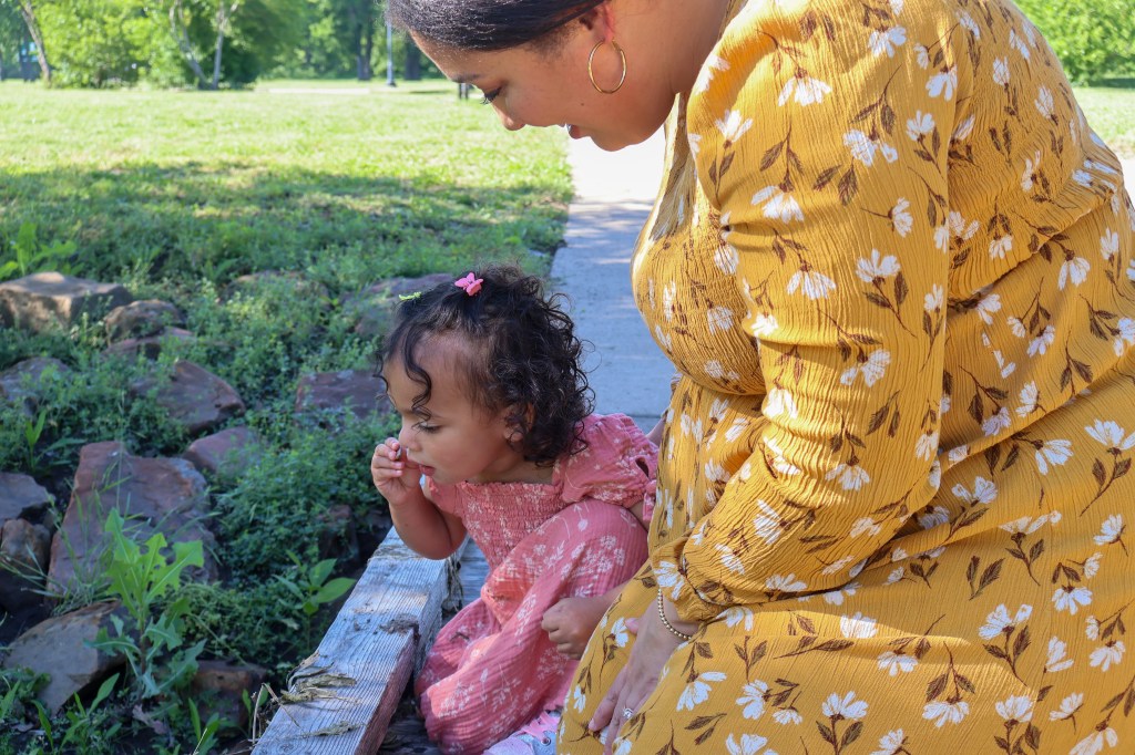 Mom and daughter looking at stream