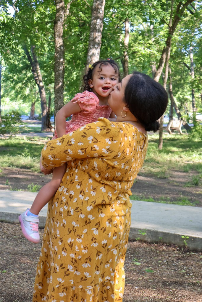 Mom and daughter kisses